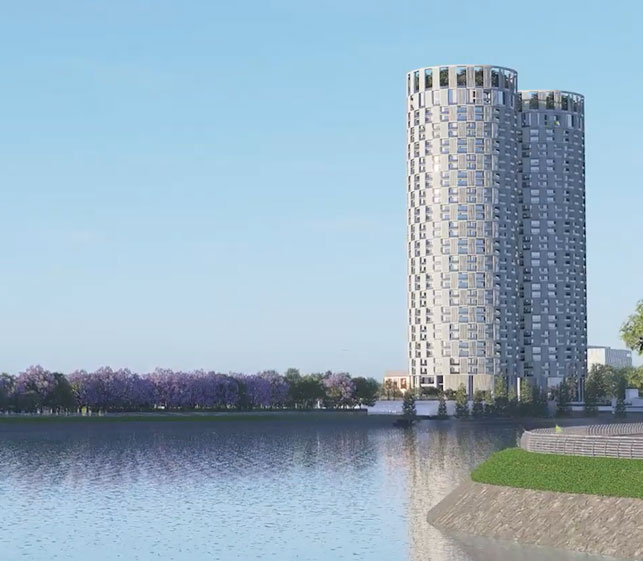 GWT twin towers rising beside the lake at dusk